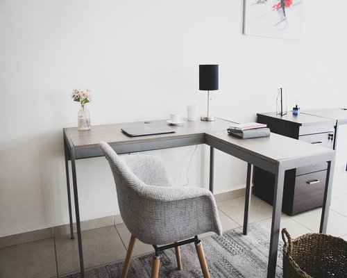 A laptop on a clean wooden desk