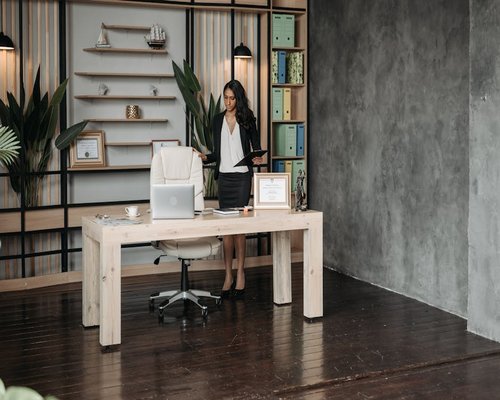 Person standing up from a desk chair
