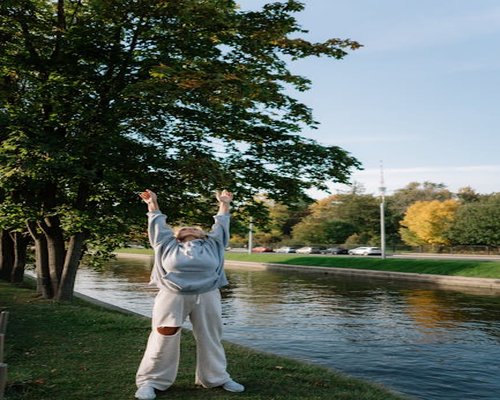 Person standing up stretching softly